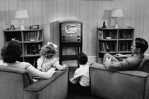 Family in front of a TV
