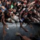 Rohingya refugees wait to receive aid in Cox's Bazar.