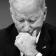 A black-and-white photo of Joe Biden looking pensive