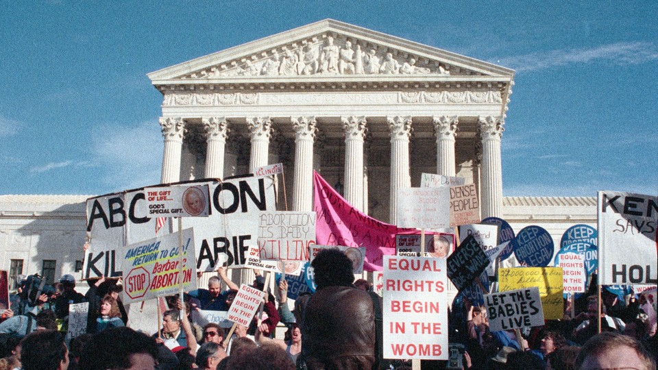 A photo of anti-abortion activists in front of the Supreme Court