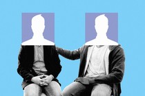 Two seated figures with heads that are the square Facebook default picture