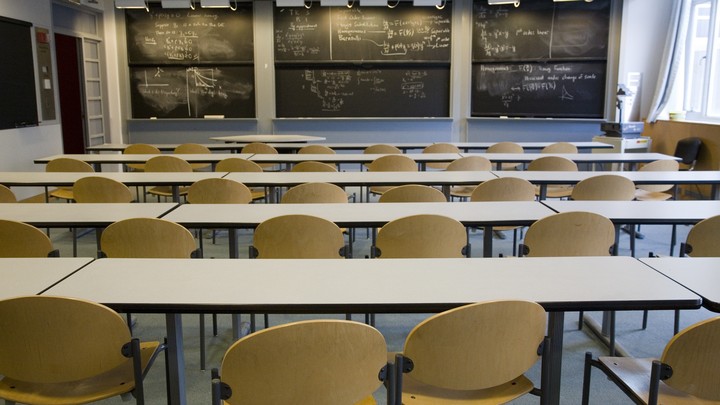 A classroom, with writing on the blackboard, at MIT