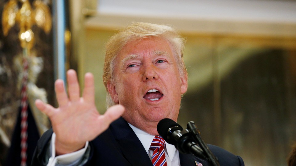 President Trump speaks to reporters at a press briefing.