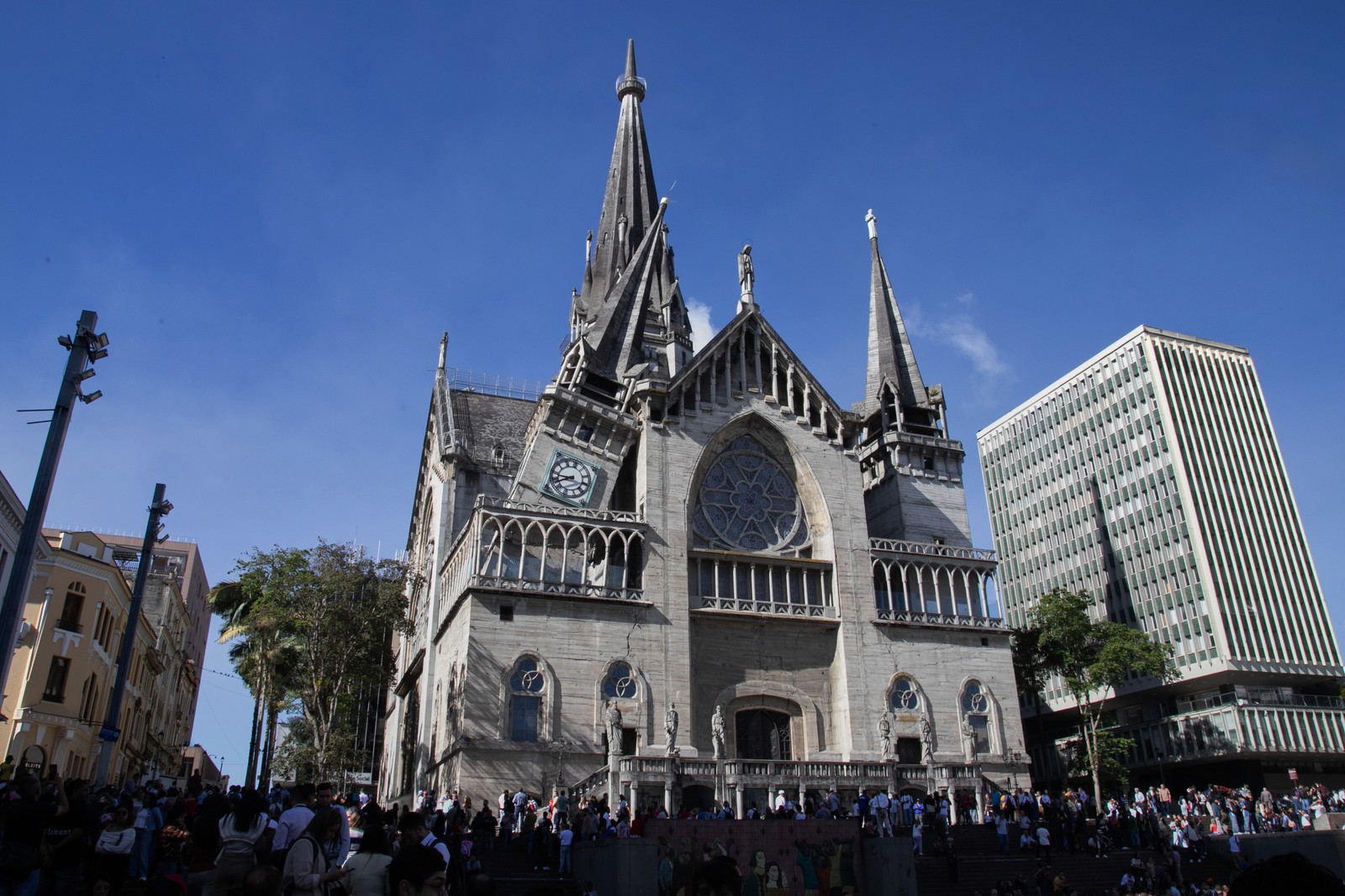 One of the towers of a cathedral sits at an angle, partially-collapsed after an earthquake.