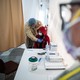 A doctor examines Juan Vasquez for a COVID-19 test inside a testing tent at St. Barnabas hospital on March 20, 2020 in New York City. St. Barnabas hospital in the Bronx set-up tents to triage possible COVID-19 patients outside before they enter the main Emergency department area.