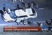 A police vehicle is damaged after protests broke out Tuesday in Charlotte, North Carolina, following a fatal shooting of a black man by police. 