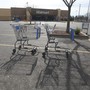 Two shopping carts in a Walmart parking lot 