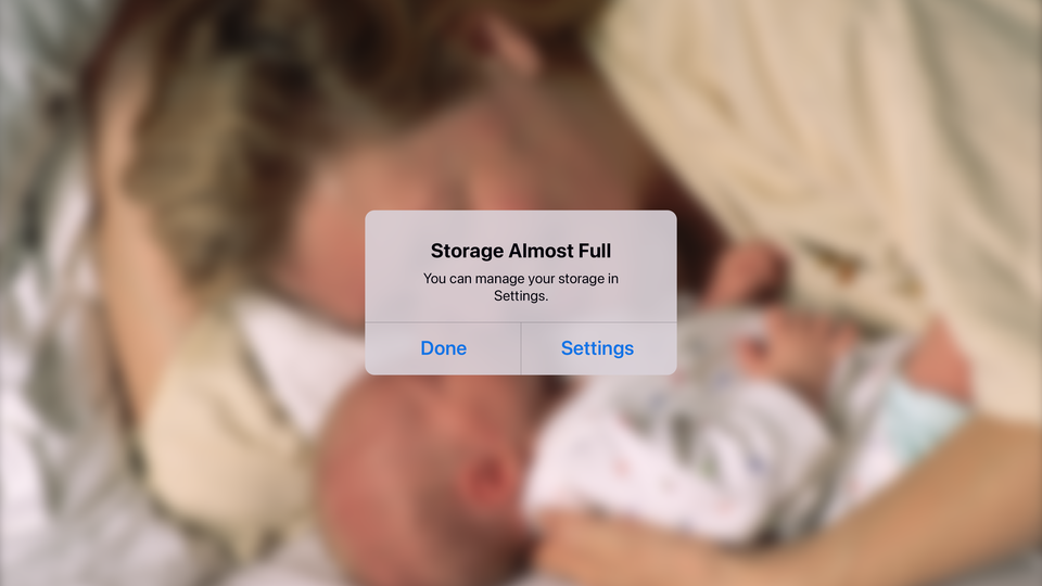 A "storage almost full" notification appears over a photo of a parent and their baby