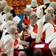 A photograph of peers, some in wigs, sitting in the chamber of the U.K. House of Lords