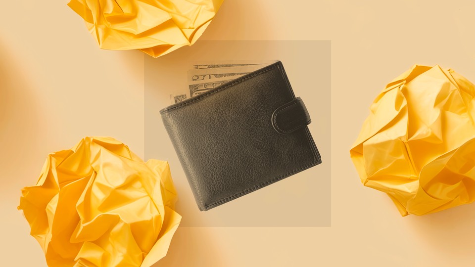 A black and white photo shows a leather wallet with a series of dollar bills coming out of the top
