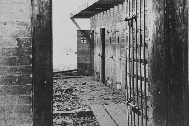 Interior view of a slave pen, showing the doors of cells where the slaves were held before being sold