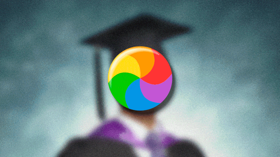 Blurry photo of a student in a graduation cap and gown with a spinning rainbow wheel over their face