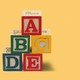 A pyramid of blocks that read A, B, C, D, E. The lower right corner of the pyramid is missing, and a block reading F is on its own to the right