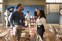 Janine and Gregory stand next to each other in Abbott Elementary