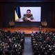 Ukrainian President Volodymyr Zelensky on a screen addressing the U.S. Congress.