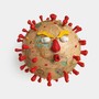 An illustration of a globe made to look like the coronavirus with Donald Trump's face