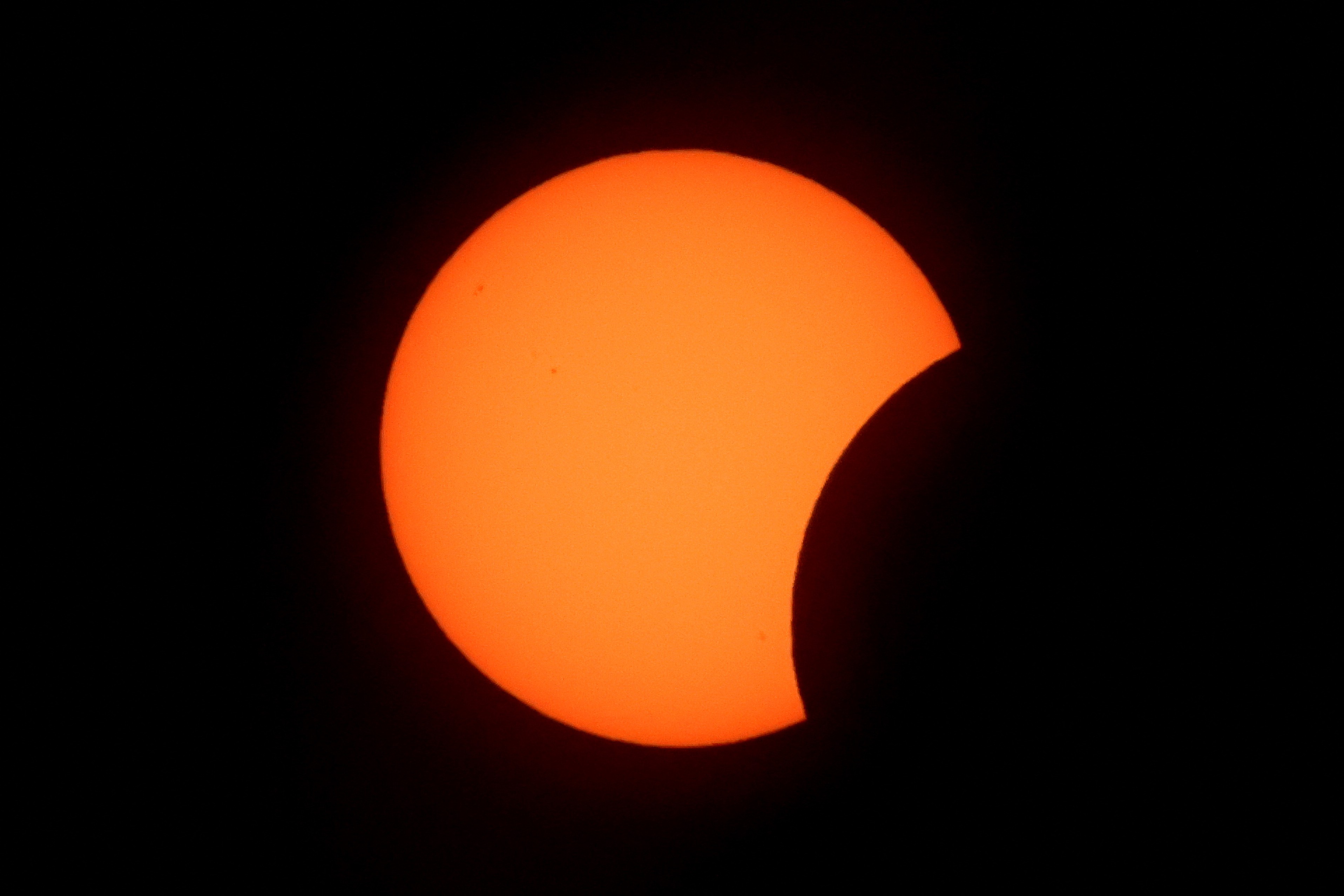 A partially-blocked sun, seen during an eclipse
