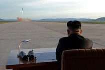 Kim Jong Un watches the launch of a Hwasong-12 missile. 