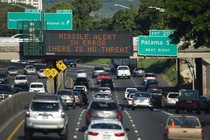sign on a highway in Honolulu clarifies that the emergency nuclear missile alert was a false alarm. 