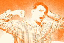 An orange-tinted image of a man stretching