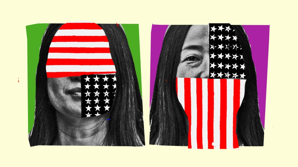 An Asian American woman whose face is covered by the American flag