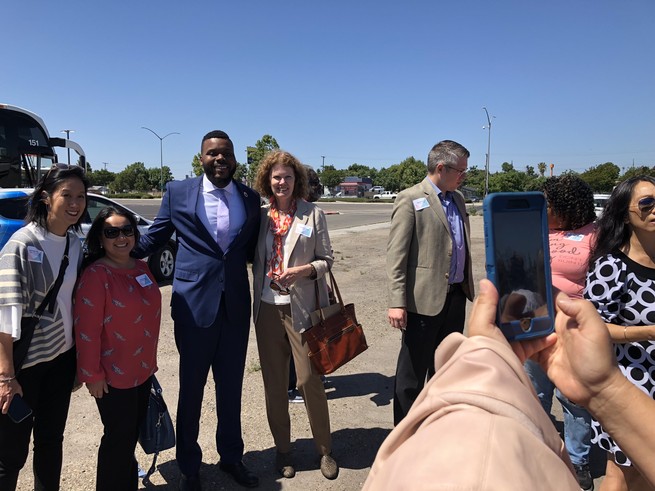 Stockton’s Mayor Michael Tubbs gets his picture taken with visiting philanthropists