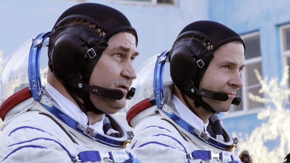 Russian cosmonaut Alexey Ovchinin (left) and American astronaut Nick Hague