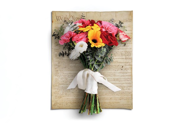 photo-illustration of the U.S. Constitution with a bouquet of flowers tied with ribbon on top of it
