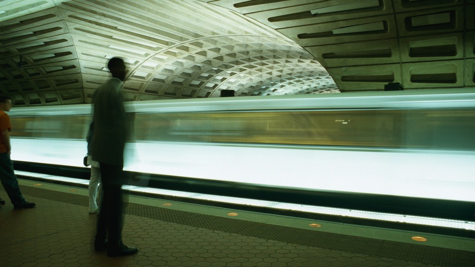 A train moves through a metro station in Washington, DC.