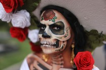 A person wearing elaborate skull makeup