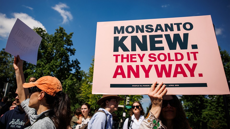an anti-monsanto sign at the people v poison rally