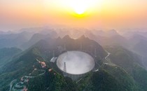 China's FAST telescope sits nestled in a mountainside.