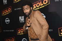 Donald Glover points at a premiere event for "Star Wars: Solo."