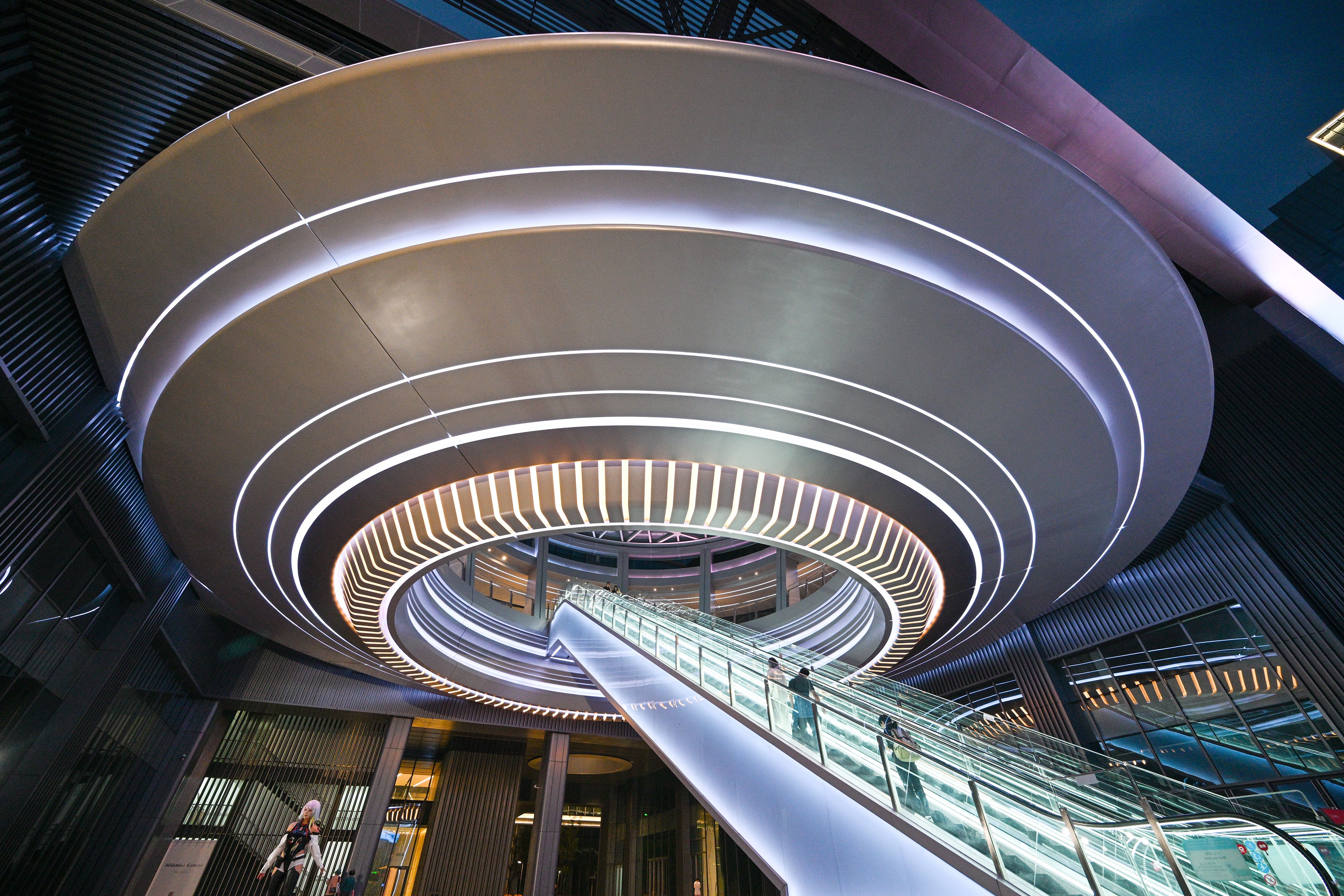 Several people rode the escalator to the bottom of the flying ring structure.