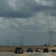 Transmission lines and cars on a road in Texas