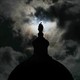 Dark clouds move over the Statue of Freedom on top of the U.S. Capitol Dome