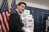 House Speaker Paul Ryan pointing to boxes of petitions supporting a tax-reform bill