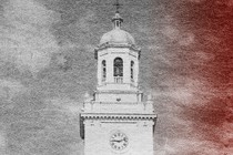 Black and white image of a college building with red color seeping in from the right