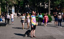 a person with a dog in Washington Square Park in May of 2021