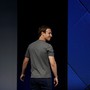 Mark Zuckerberg looks over his shoulder.