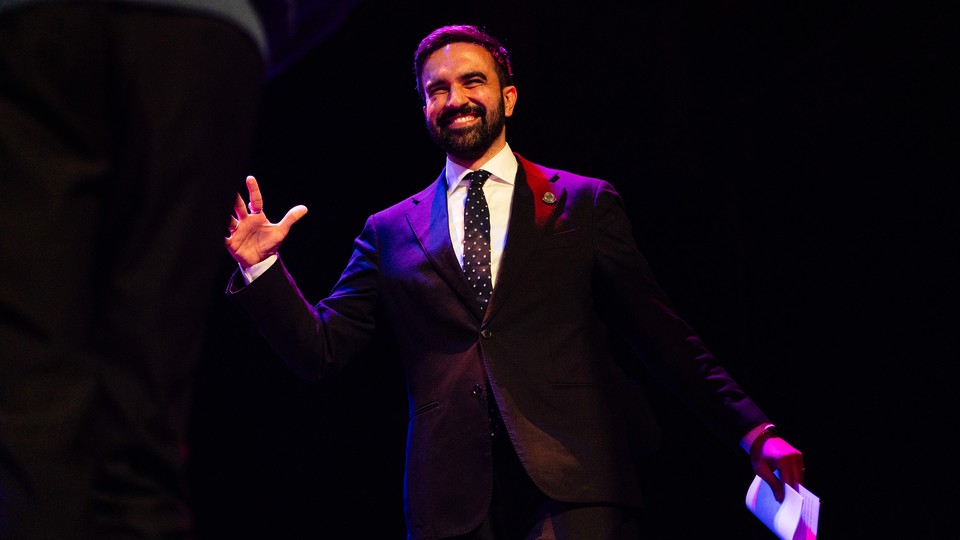 Zohran Mamdani grinning