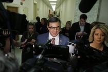 Representative Justin Amash of Michigan speaks to a throng of reporters.