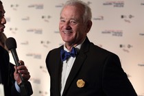 Bill Murray smiles for a camera after arriving at the Kennedy Center for the Performing Arts for the 19th Annual Mark Twain Prize for American Humor presented to Bill Murray on Sunday, Oct. 23, 2016, in Washington.
