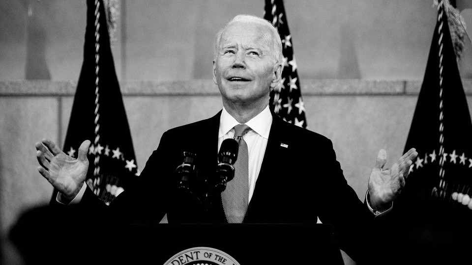 Joe Biden speaking at a podium.