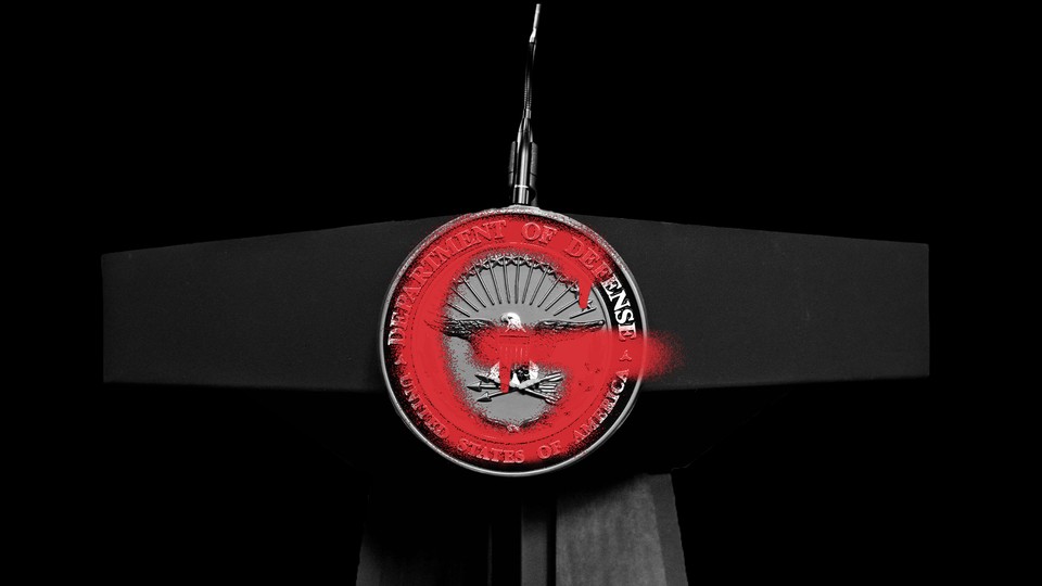 A "G" spray-painted on the Department of Defense logo