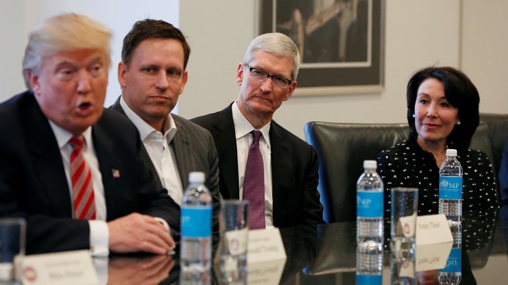 Donald Trump at a meeting in December with the tech investor Peter Thiel, Apple's CEO, Tim Cook, and Oracle's CEO, Safra Catz