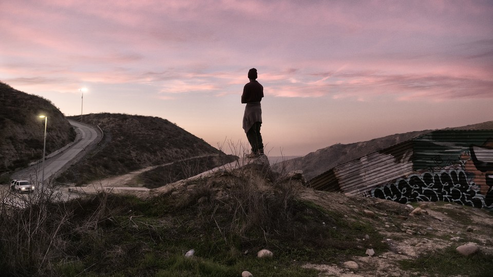 An image of a man standing in front of a highway