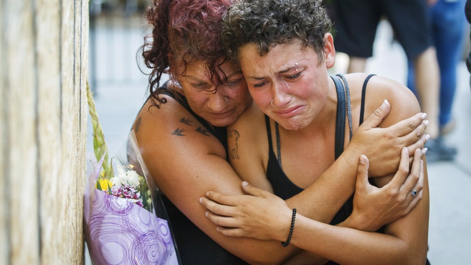 Desirae Shapiro and her mother, Gina Shapiro, friends of the 18-year-old Toronto shooting victim Reese Fallon, mourn after visiting a makeshift memorial