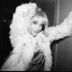 A black-and-white picture of a blonde St. Vincent in a fluffy jacket