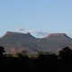 The two bluffs, known as the 'Bears Ears,' stand off in the distance at sunset in the Bears Ears National Monument